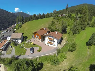 an aerial view of a house on a hill at Residence Engel in Nova Levante
