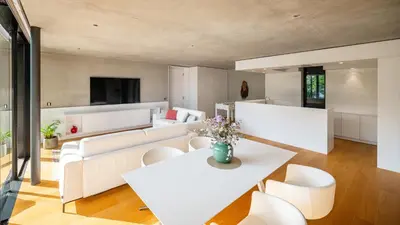 a living room with white furniture and a white table at Olivia in Tirolo