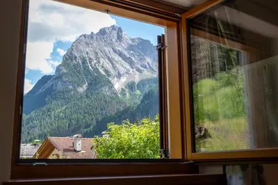 a window with a view of a mountain at Cesa Leo in Canazei