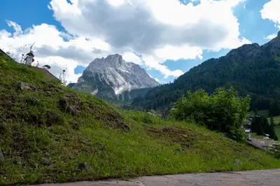 a hill with a mountain in the background at Cesa Leo in Canazei