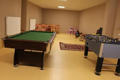 two pool tables in a living room with at Ciasa Mirio' in La Valle