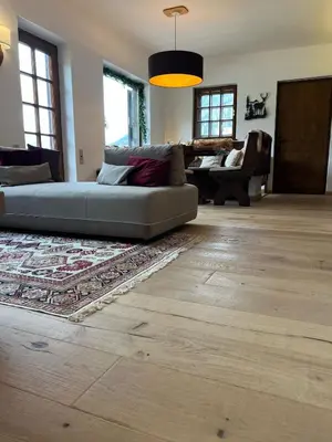 a living room with a couch and a rug at Casalta by Go New Location in Moena