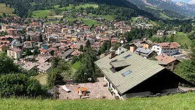 an aerial view of a town in a valley at Casalta by Go New Location in Moena