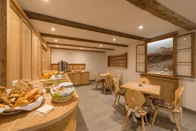 a kitchen with a table with a bunch of food on it at Waldheim Appartements in Bressanone