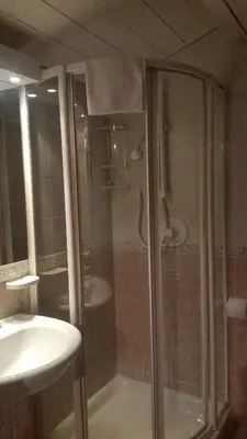a bathroom with a shower and a sink at Chalet Belvedere in Arabba