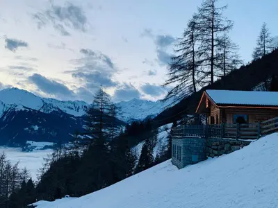 a cabin on top of a snow covered mountain at Chalet Leitn-Anger in San Leonardo in Passiria