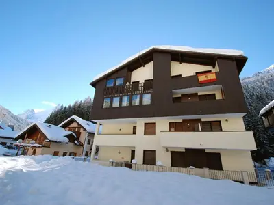 a large white building with balconies on it at Apartment Des Alpes-3 by Interhome in Canazei