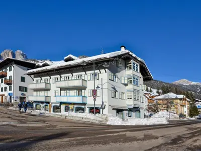 a large white building with snow on the roof at Apartment Villa Placidia Apt 32 by Interhome in Campitello di Fassa