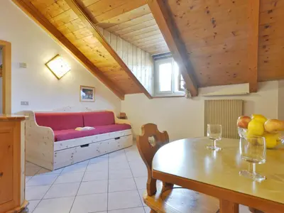 a living room with a couch and a table at Apartment Villa Placidia Apt 34 by Interhome in Campitello di Fassa
