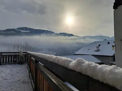 a snow covered balcony with a view of a mountain at Pignathof Rosacea in Campodazzo