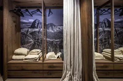 a room with a window with a mountain mural at Chalet Urela Luxury Apartment in Santa Cristina in Val Gardena