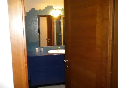 a bathroom with a sink and a mirror at B&B fam. Ausermiller in Castello di Fiemme
