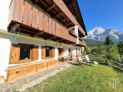 a house with mountains in the background at HT - Ciasa Dahu Cortina Escape in San Vito di Cadore