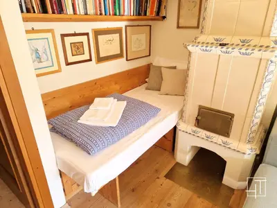 a bunk bed in a room with bookshelves at HT - Ciasa Dahu Cortina Escape in San Vito di Cadore