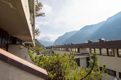a view from the balcony of a building with mountains at Casa Franz in Val di Fassa by Zoom In Earth in Mazzin