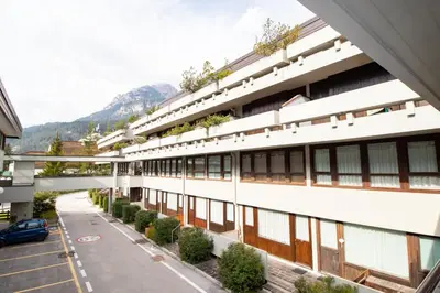 an external view of a building with a street at Casa Franz in Val di Fassa by Zoom In Earth in Mazzin