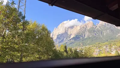 a view of a mountain with a town and trees at Chalet Stravedo by Ca-Sa Check in Villanova