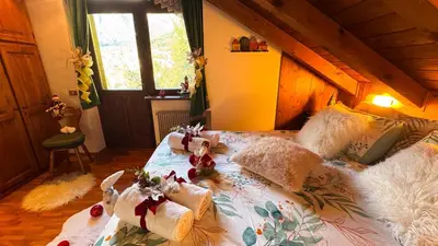 a bedroom with a bed with stuffed animals on it at Chalet Stravedo by Ca-Sa Check in Villanova
