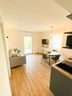 a living room with a couch and a table at Amontis Dolomites in Siusi