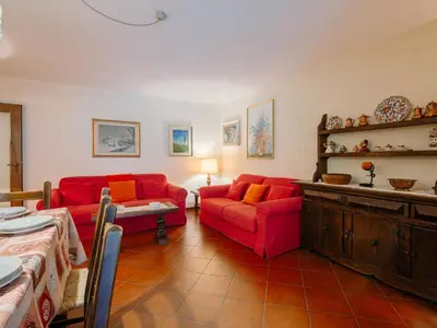 a room with a wooden cabinet and a door at Apartment Condominio al Parco-11 by Interhome in Canazei