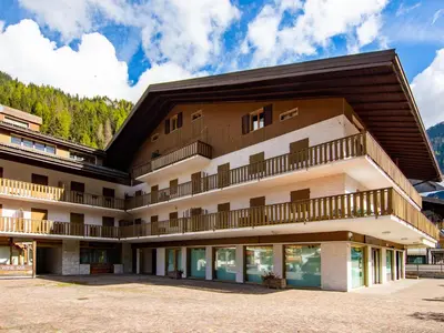 a building with balconies on the side of it at Apartment Condominio al Parco-11 by Interhome in Canazei