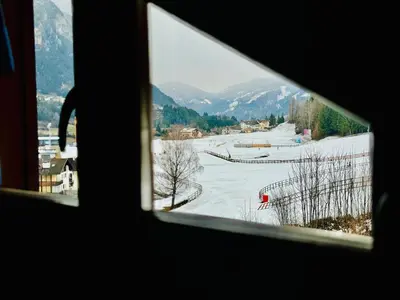 a view from a window of a ski slope at Zirmo - Your nordic stay in Tesero