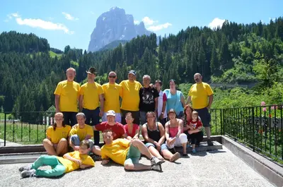 a group of people posing for a picture on a bridge at Garni Ossi in Santa Cristina in Val Gardena