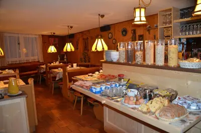 a restaurant with a lot of food on a counter at Garni Ossi in Santa Cristina in Val Gardena