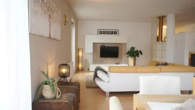a living room with a couch and a bed at Apartment 66 - Modernes Apartment mit Balkon und Parkplatz in Toplage in Brixen in Bressanone