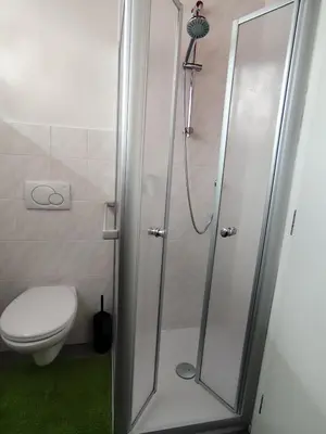 a bathroom with a shower and a toilet at Apartment 66 - Modernes Apartment mit Balkon und Parkplatz in Toplage in Brixen in Bressanone