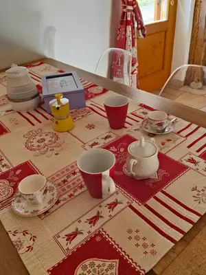 a table topped with cups and saucers on a table at Casa Lazer in Tonadico