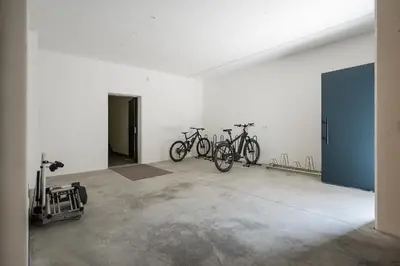 a group of bikes parked in a room at Tommelehof in Lagundo