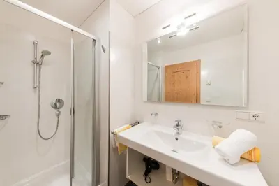 a bathroom with a sink and a shower at Tommelehof in Lagundo