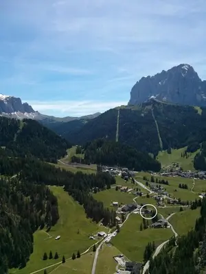 an aerial view of a village in the mountains at Hotel Val in Selva di Val Gardena