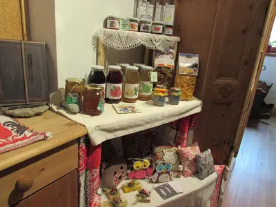 a table with food and other items on it at Schornhof in Aldino