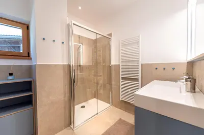 a bathroom with a shower and a sink at Apartments Vedl Luech da Plajes in Ortisei