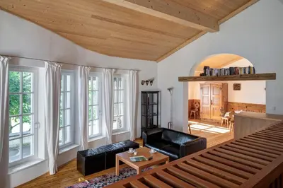 a living room with a couch and a table at Landhaus Leonhard in Egna