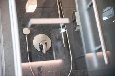 a bathroom with a shower and a sink at Villa Tony - Small Romantic Hotel in Corvara in Badia