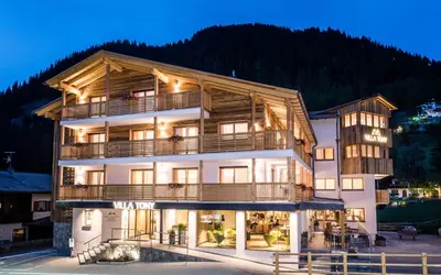 a view of a mountain from a building at Villa Tony - Small Romantic Hotel in Corvara in Badia