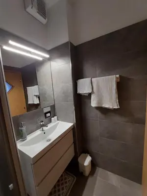 a bathroom with a sink and a mirror at Bed & breakfast Villa Maria in Cavalese
