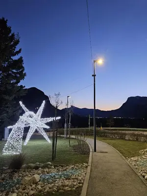 a lighted star sculpture in a park with a street light at Casa Romy in Rovere della Luna