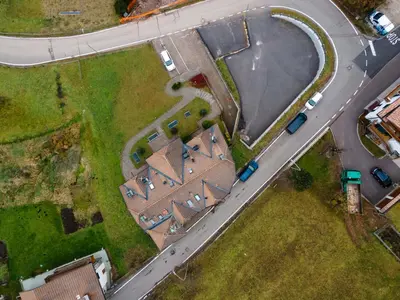 an overhead view of a farm with a road at Appartamento Green House in Moena