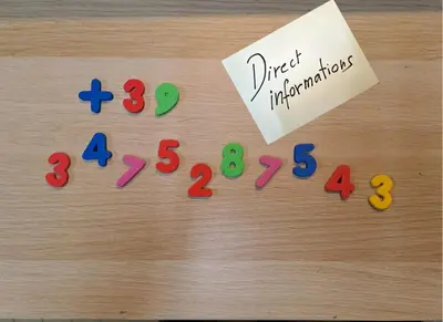 a group of colored numbers on a table next to a note at Agordo Col di Foglia in Agordo