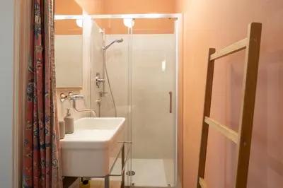 a bathroom with a sink and a glass shower at Appartement Laurin 2 guestcard incl in Merano