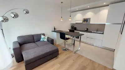 a living room with a couch and a table at Casa Grazia - Merano in Merano