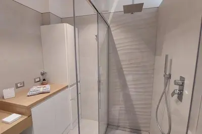 a shower with a glass door in a bathroom at Casa Grazia - Merano in Merano