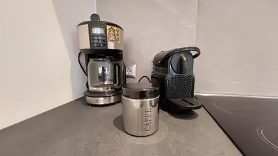 a coffeemaker and a coffee maker on a counter at Casa Grazia - Merano in Merano