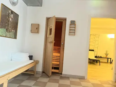 a room with a bed and a wooden door at Respira il Bosco in Anterivo