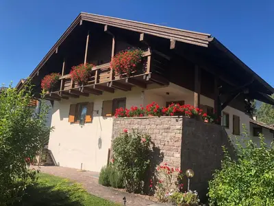 a house with flower boxes on the balcony at CASA BRUNELLA in Cavalese