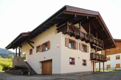 a building with balconies on the side of it at CASA BRUNELLA in Cavalese